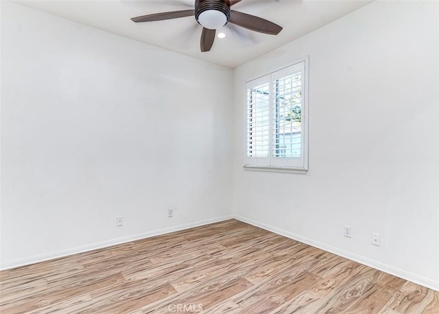 empty room featuring light wood-type flooring and ceiling fan