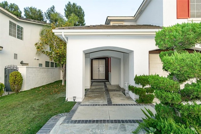 doorway to property featuring a yard