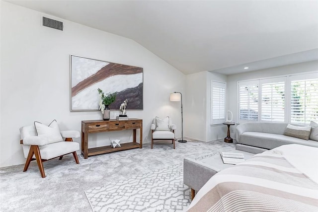 bedroom with light carpet and vaulted ceiling