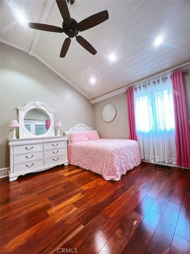 bedroom with ornamental molding, lofted ceiling, dark wood-type flooring, and ceiling fan