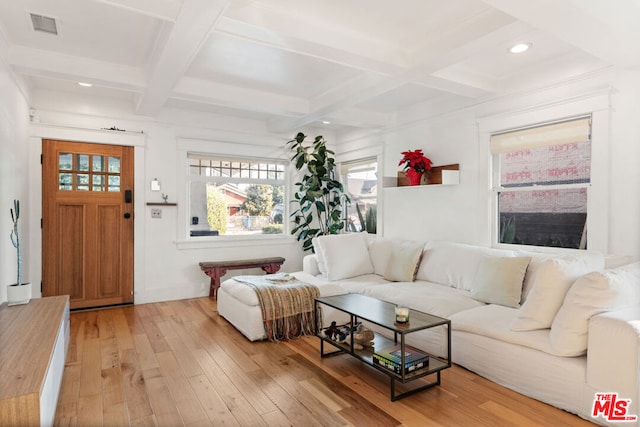 living room featuring beamed ceiling, wood-type flooring, and coffered ceiling