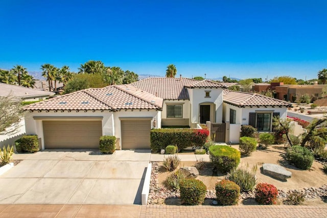 mediterranean / spanish house with a garage