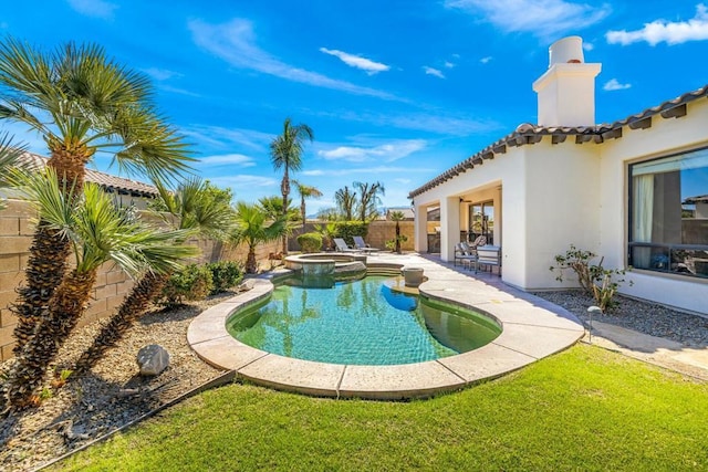 view of pool with an in ground hot tub and a patio