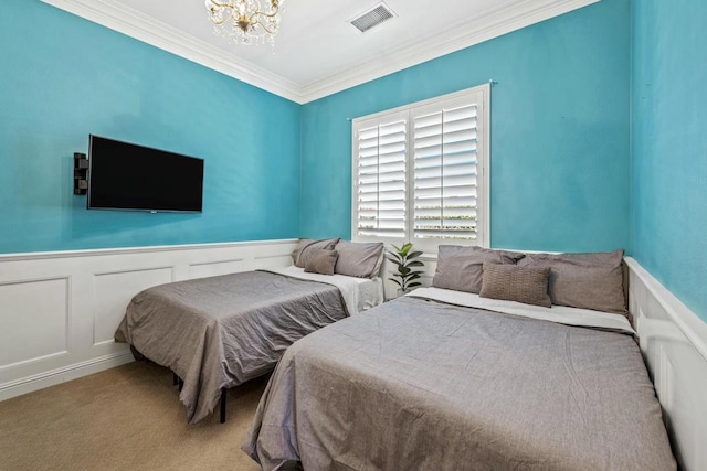 bedroom featuring carpet, a notable chandelier, and ornamental molding