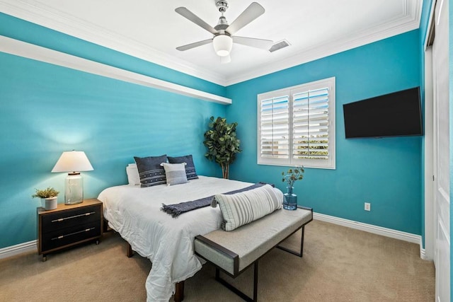 carpeted bedroom with ceiling fan and crown molding