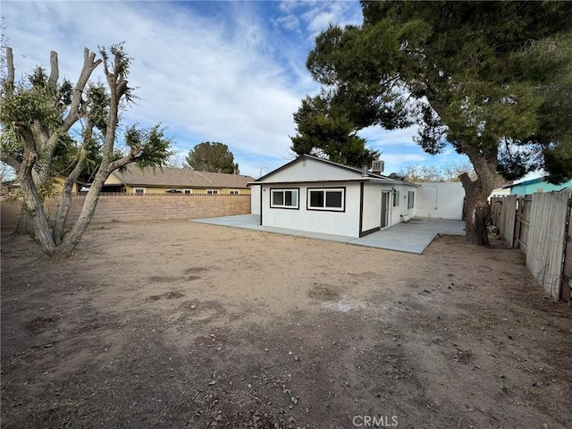 back of property featuring a patio area