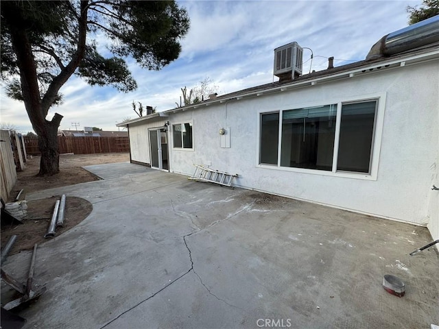 exterior space with a patio and central air condition unit