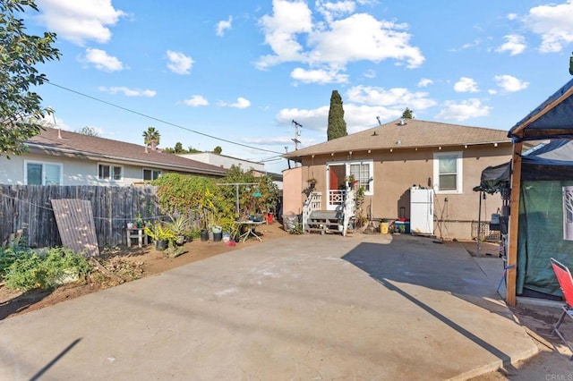 rear view of property with a patio area