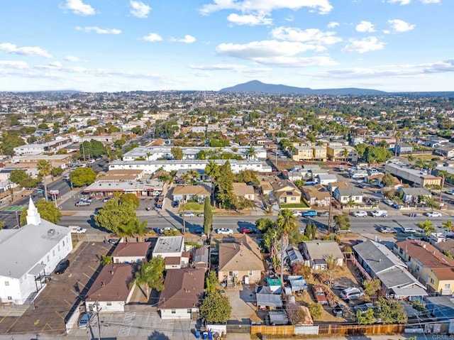 birds eye view of property featuring a mountain view