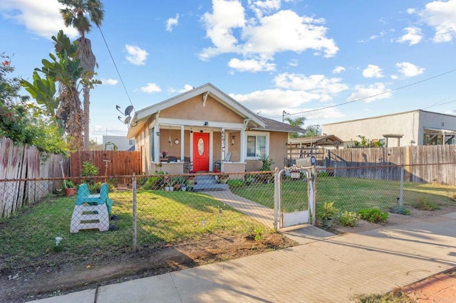 bungalow-style house featuring a front yard and covered porch