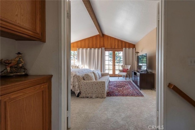 living room featuring carpet and lofted ceiling with beams