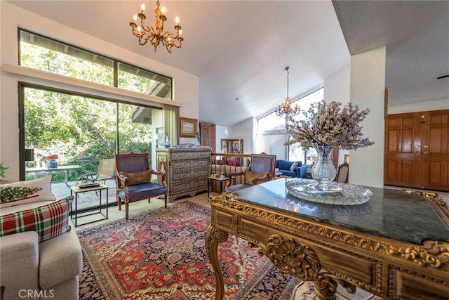 dining area with vaulted ceiling and a notable chandelier