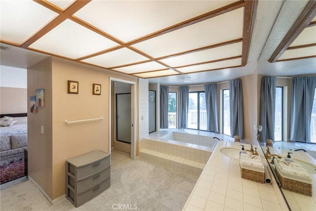 bathroom featuring a washtub, coffered ceiling, and sink