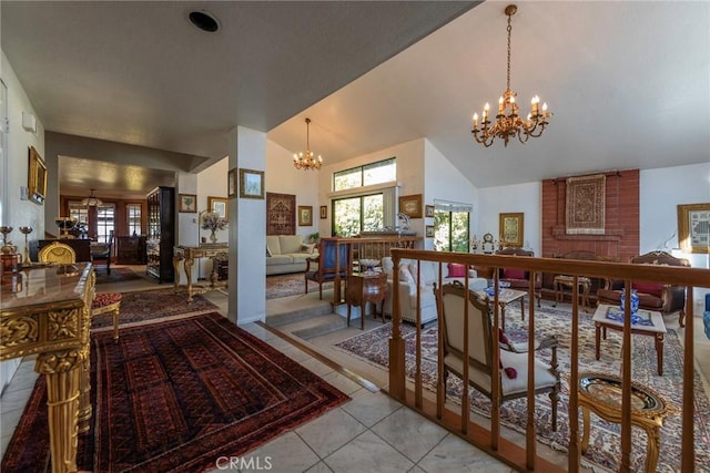 tiled dining room featuring a fireplace, high vaulted ceiling, and a chandelier