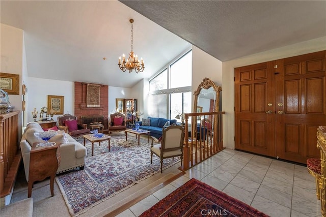 living room featuring a chandelier, a brick fireplace, a textured ceiling, and high vaulted ceiling