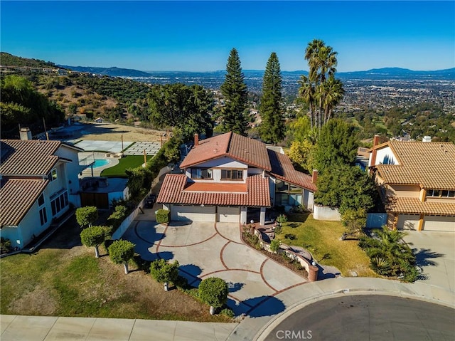 birds eye view of property with a mountain view