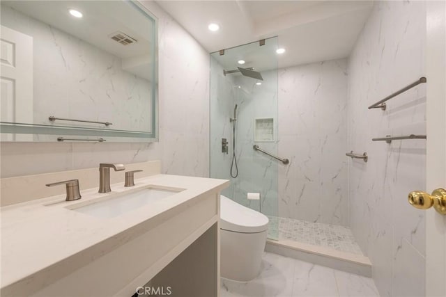 bathroom featuring toilet, visible vents, vanity, marble finish floor, and a marble finish shower