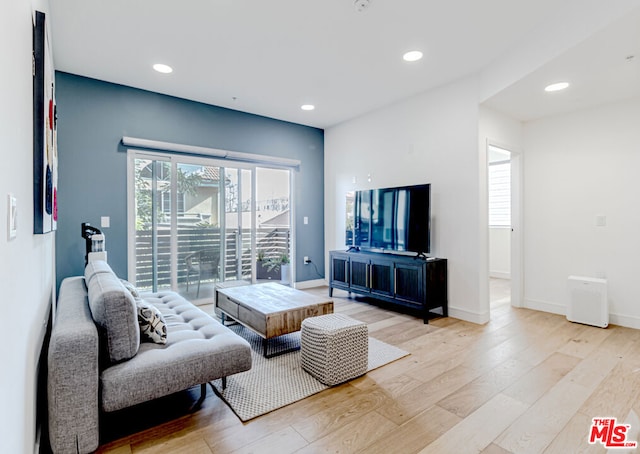 living room with light hardwood / wood-style floors