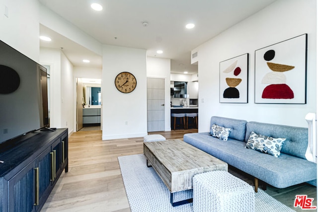 living room featuring light wood-type flooring