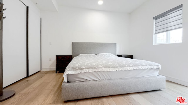 bedroom with light hardwood / wood-style floors