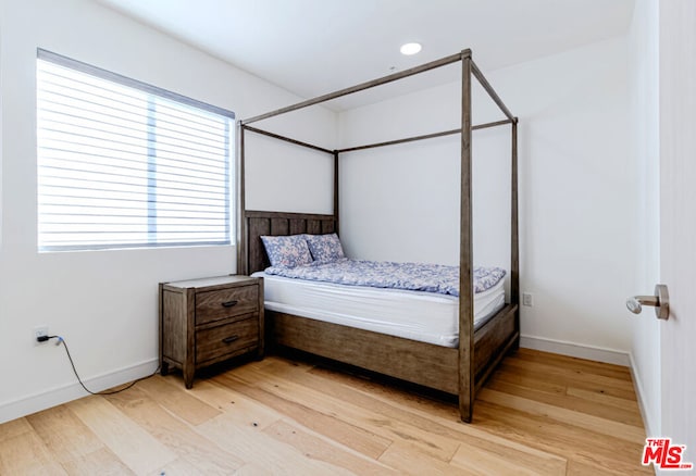 bedroom with light hardwood / wood-style floors