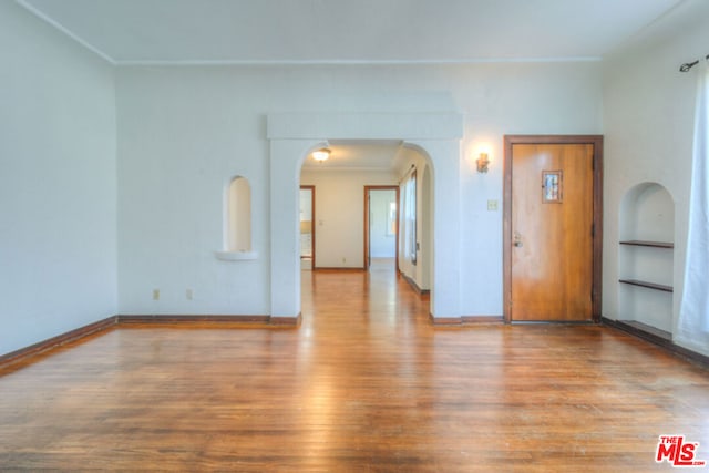 spare room with light hardwood / wood-style flooring