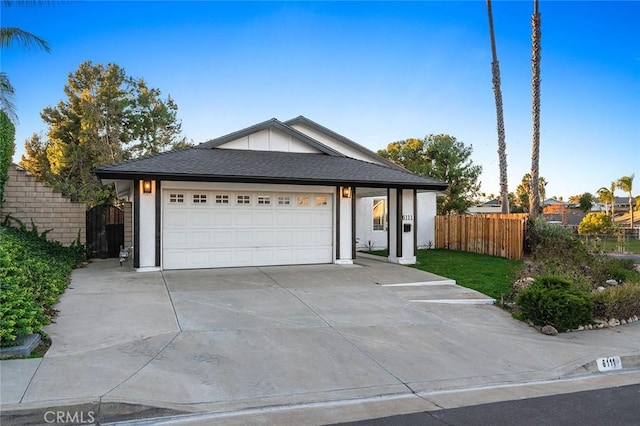 ranch-style home featuring a garage