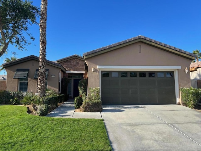 single story home with a front lawn and a garage