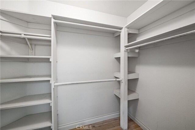 324 Sundance Cir, Palm Desert, CA 92211 - spacious closet featuring hardwood / wood-style flooring