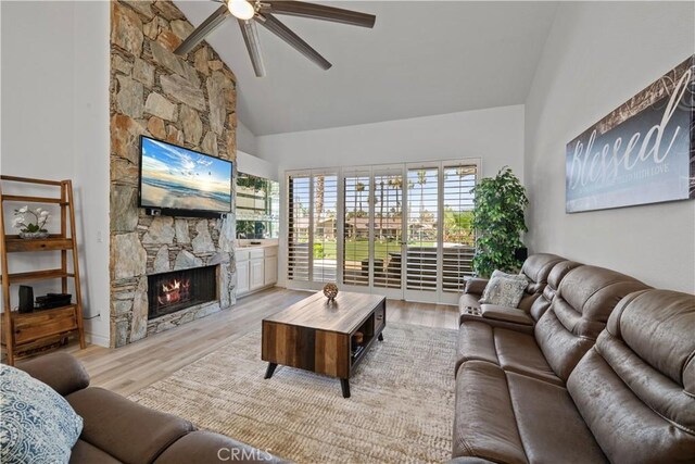 324 Sundance Cir, Palm Desert, CA 92211 - living room with ceiling fan, light wood-type flooring, a fireplace, and high vaulted ceiling