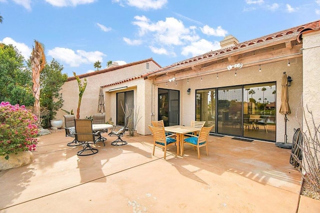 rear view of property with a patio