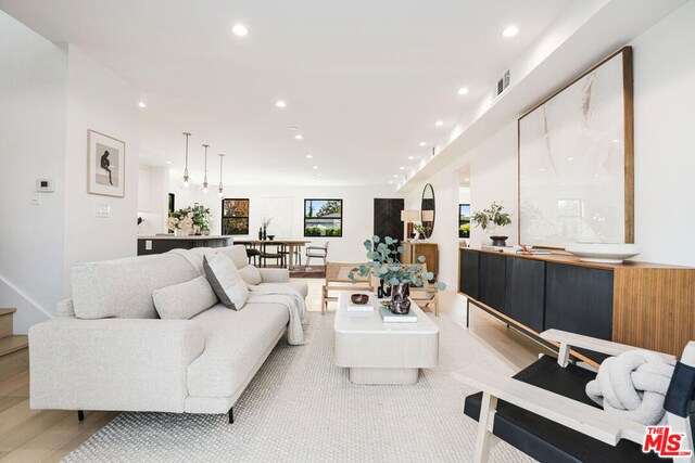 living room with light hardwood / wood-style floors