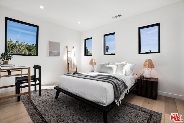 bedroom with light wood-type flooring