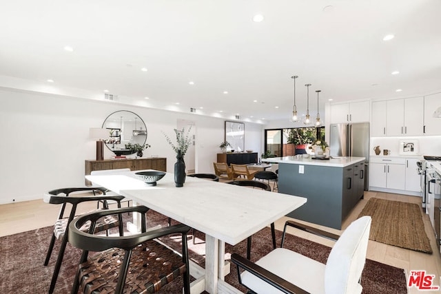 dining area with light wood-type flooring