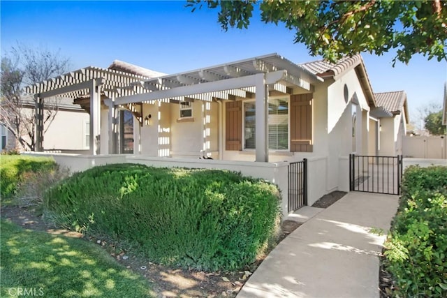 view of front of home featuring a pergola