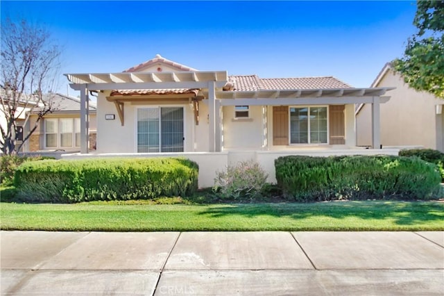 mediterranean / spanish house with a pergola and a front yard