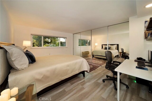 bedroom with hardwood / wood-style floors