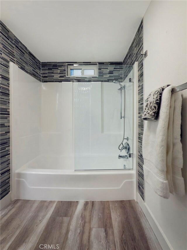 bathroom featuring shower / tub combination and wood-type flooring