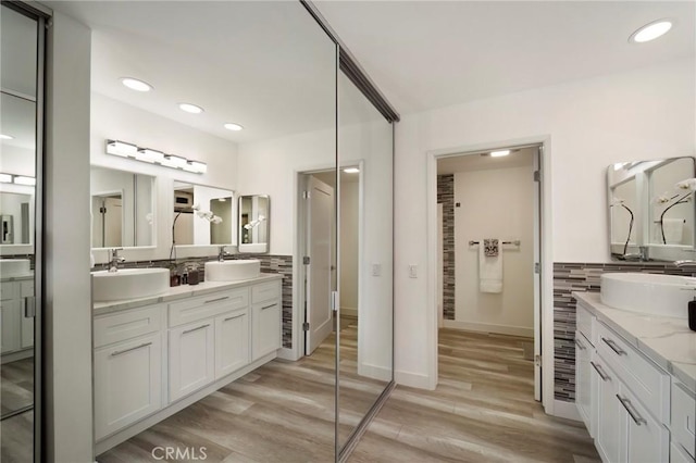 bathroom featuring vanity and hardwood / wood-style flooring