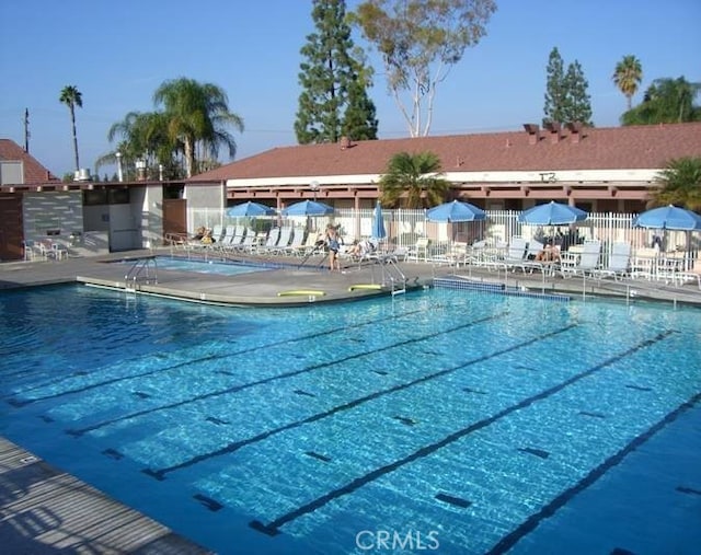 view of swimming pool with a patio