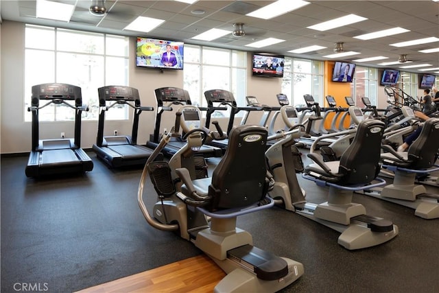 gym with a paneled ceiling