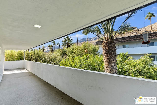 balcony featuring a mountain view