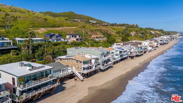 aerial view with a view of the beach and a water view