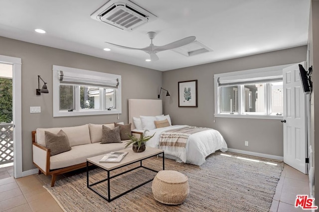 tiled bedroom with ceiling fan