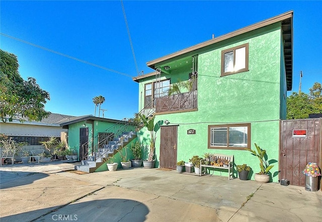 rear view of property with a patio area