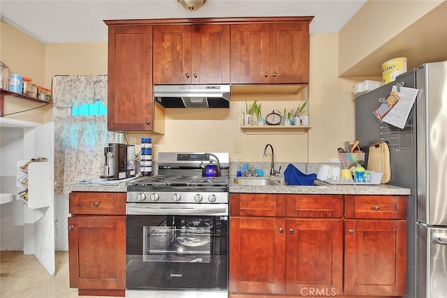 kitchen featuring light tile patterned flooring, sink, and appliances with stainless steel finishes