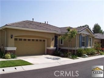 single story home featuring a garage