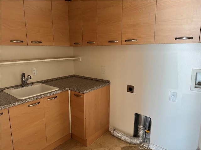 kitchen featuring light tile patterned flooring and sink