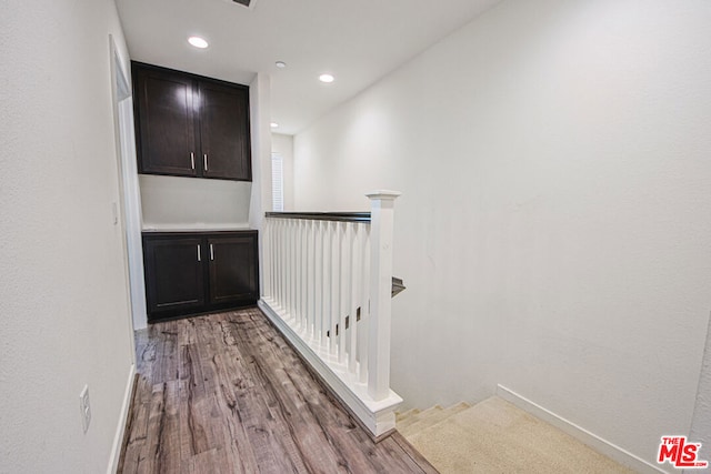 corridor featuring hardwood / wood-style floors