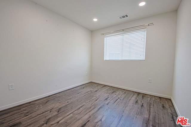 unfurnished room featuring light hardwood / wood-style floors